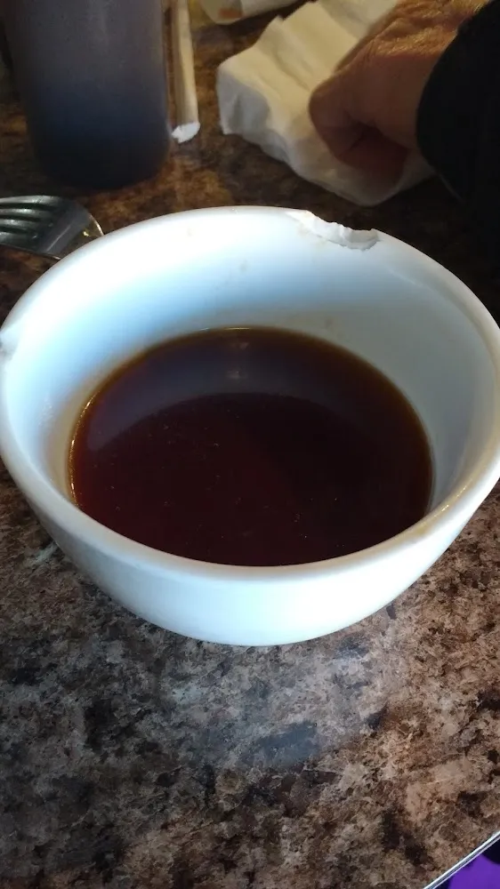 Chipped Cup of Soy Sauce